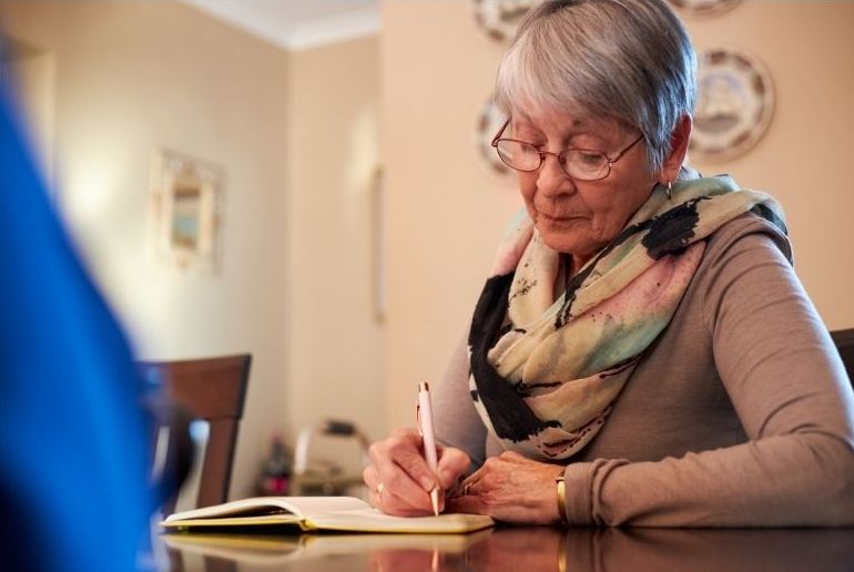 woman writing legacy memoir